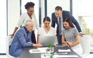 Talking business. Cropped shot of a group of businesspeople having a meeting together in an office